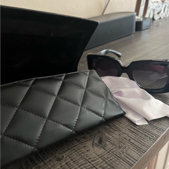 Authentic Chanel sunglasses, never used! Bought last summer...